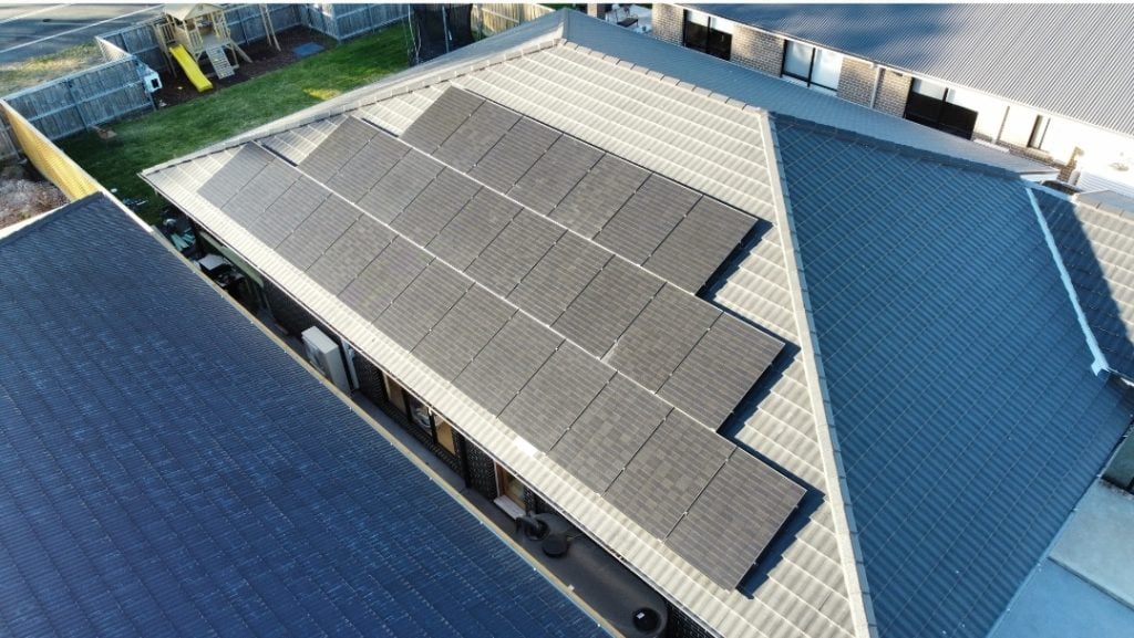 view of a suburban home with solar panels covering a significant portion of its roof